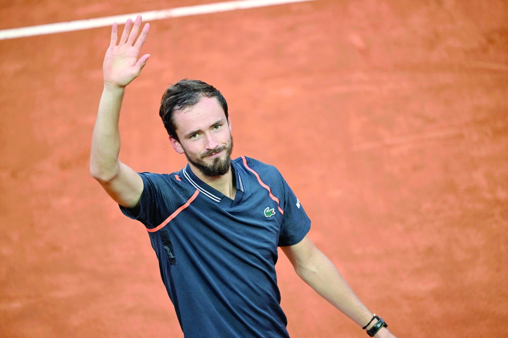 TOPSHOT - Russia's Daniil Medvedev acknowledges the crowd after winning the final of the Men's ATP Rome Open tennis tournament against Denmark's Holger Rune on the central court of Foro Italico in Rome on May 21, 2023. Medvedev beat Rune in straight sets (7-5, 7-5) to win the Men's ATP Rome Open tennis tournament. (Photo by Filippo MONTEFORTE / AFP / )

