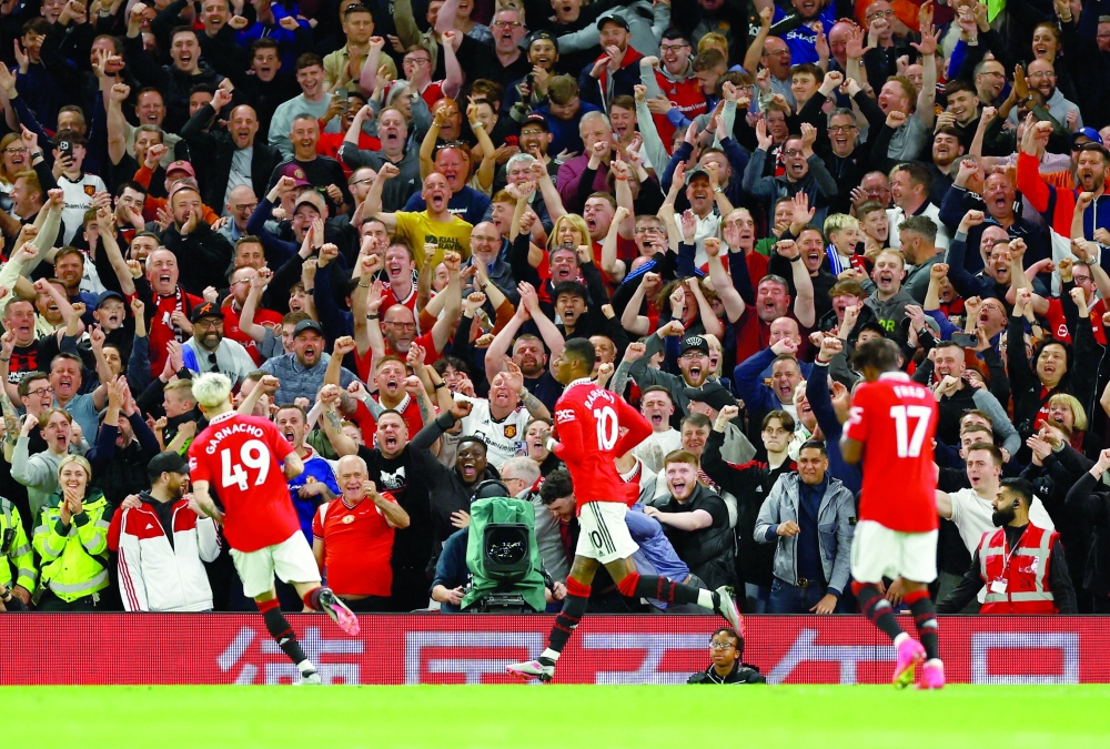 Manchester United's Marcus Rashford celebrates scoring their fourth goal with teammates REUTERS/