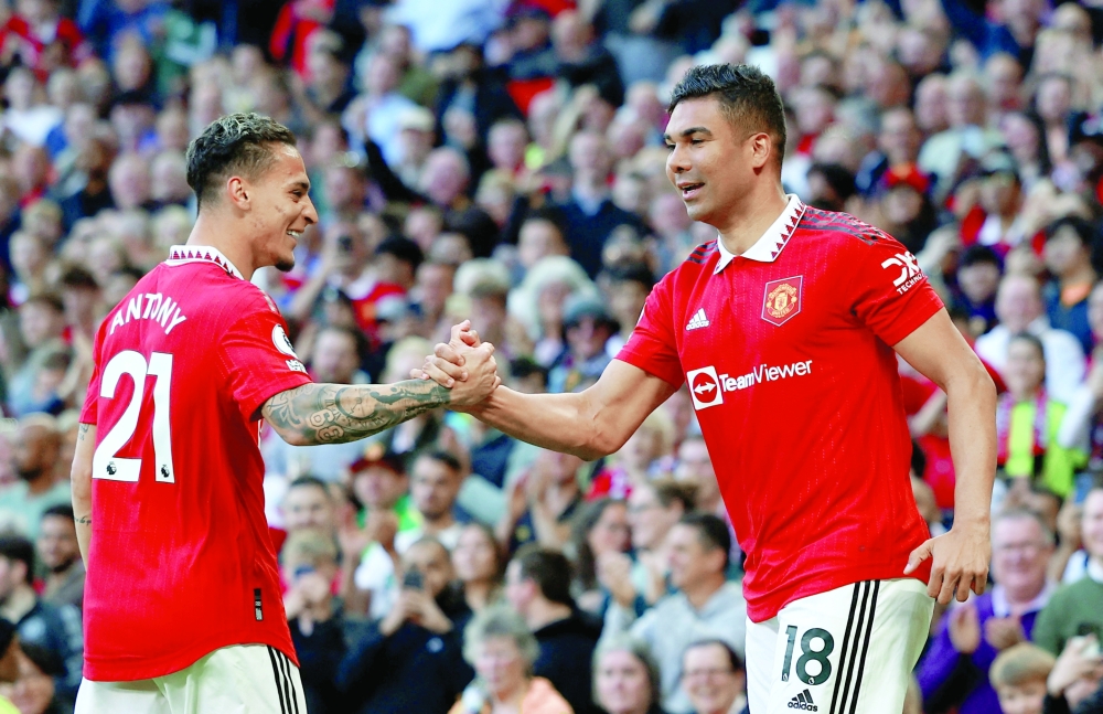  Manchester United's Casemiro celebrates scoring their first goal with Antony REUTERS