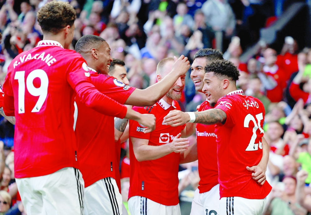 Manchester United's Casemiro celebrates scoring their first goal with teammates REUTERS