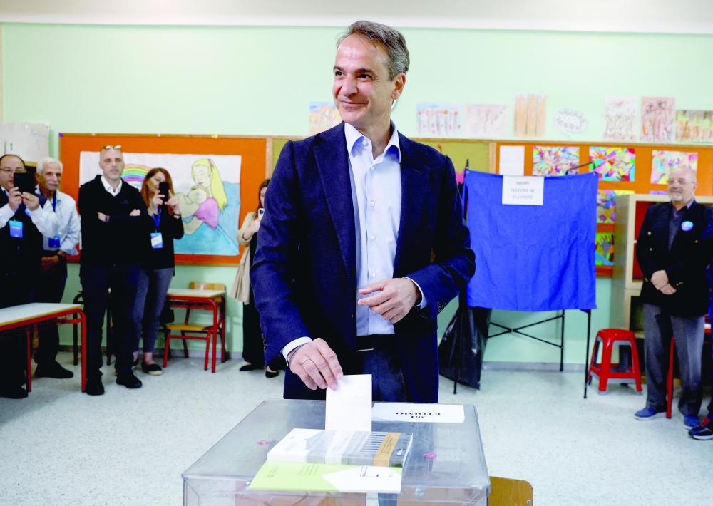 Greek Prime Minister and New Democracy conservative party leader Kyriakos Mitsotakis casts his ballot during the general election in Athens. - Reuters
