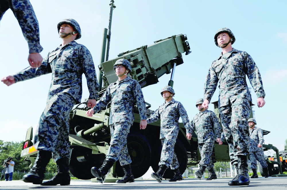 Japan Self-Defense Forces soldiers walk past a Patriot Advanced Capability-3 (PAC-3) missile unit in Tokyo. Reuters file photo. 