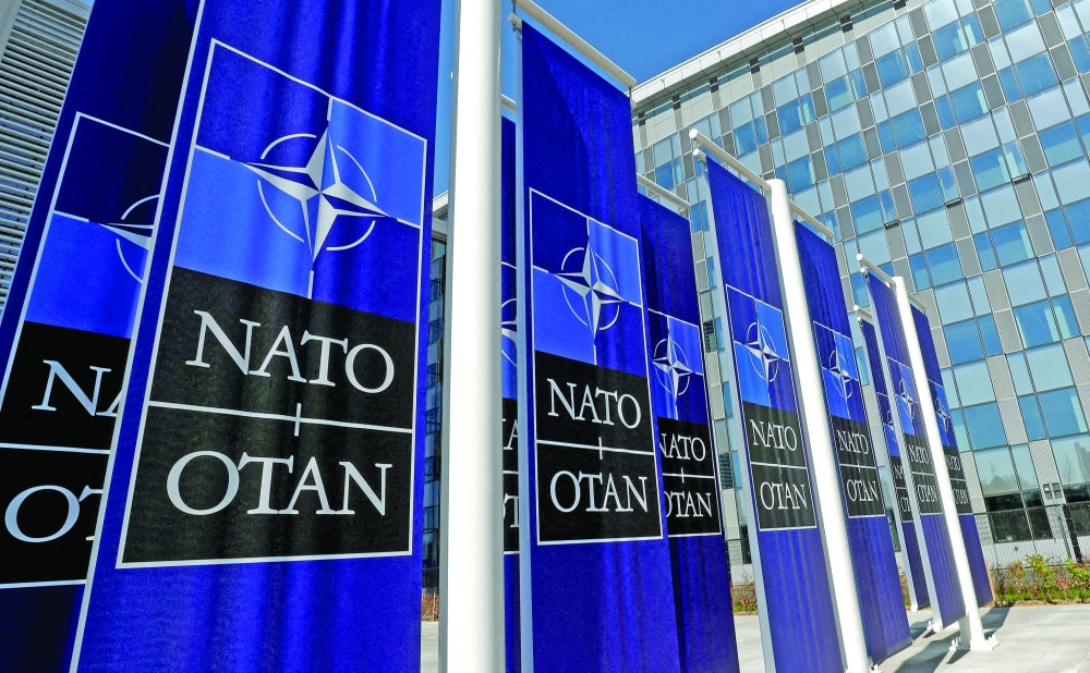 Banners displaying the Nato logo are placed at the entrance of new Nato headquarters during the move to the new building, in Brussels, Belgium. - Reuters file photo