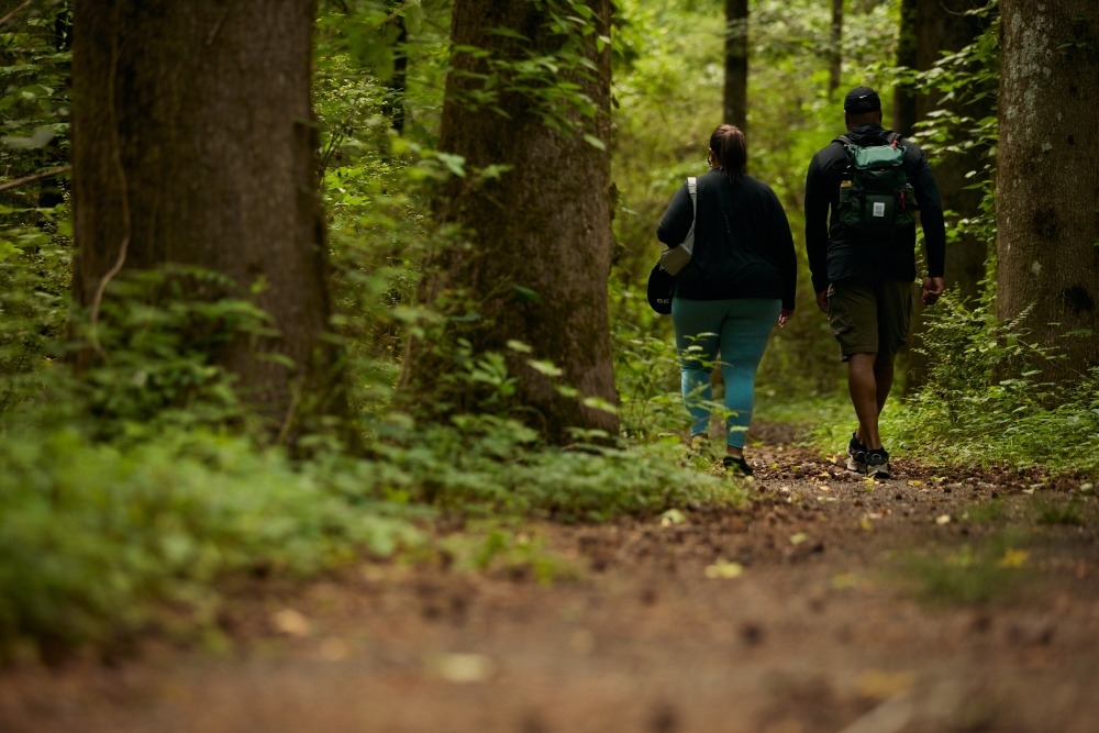 People hike through a park in Marietta, Ga., May 19, 2023. (Bee Trofort/The New York Times)