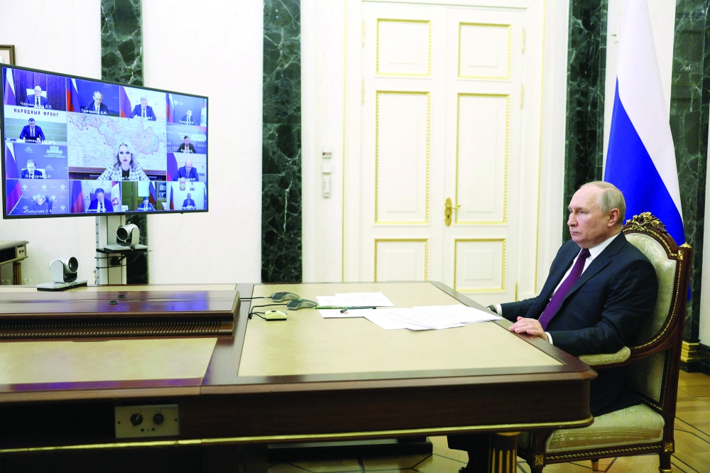Russian President Vladimir Putin chairs a meeting with members of the government via a video link at the Kremlin in Moscow. — AFP 