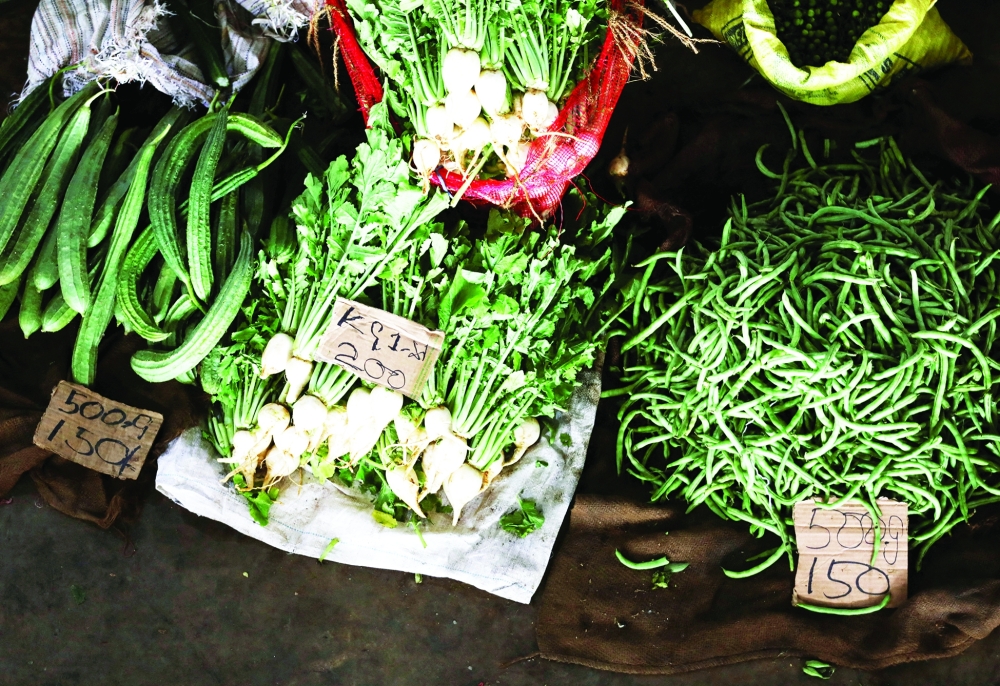 Prices of vegetables display at a stall, as Sri Lanka's key inflation rate eases to 25.2 per cent in May at a main market in Colombo. - Reuters

