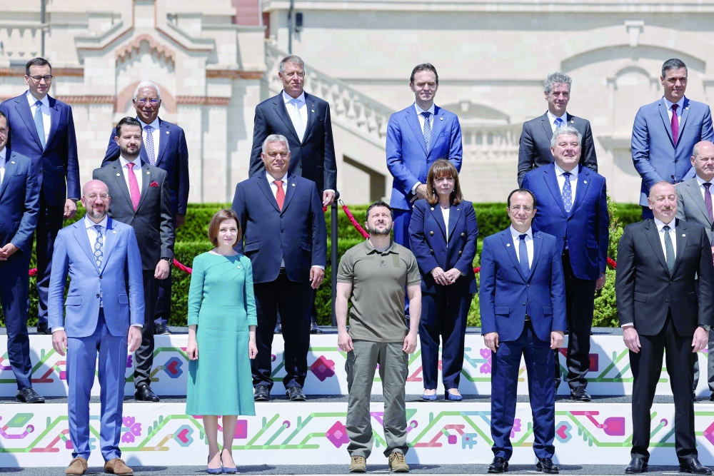Ukraine's President Volodymyr Zelensky (Bottom, President of the European Council Charles Michel (Bottom L) and Moldova's President Maia Sandu (Bottom 2L) pose with other European leaders at the European Political Community Summit in Bulboaca. - AFP