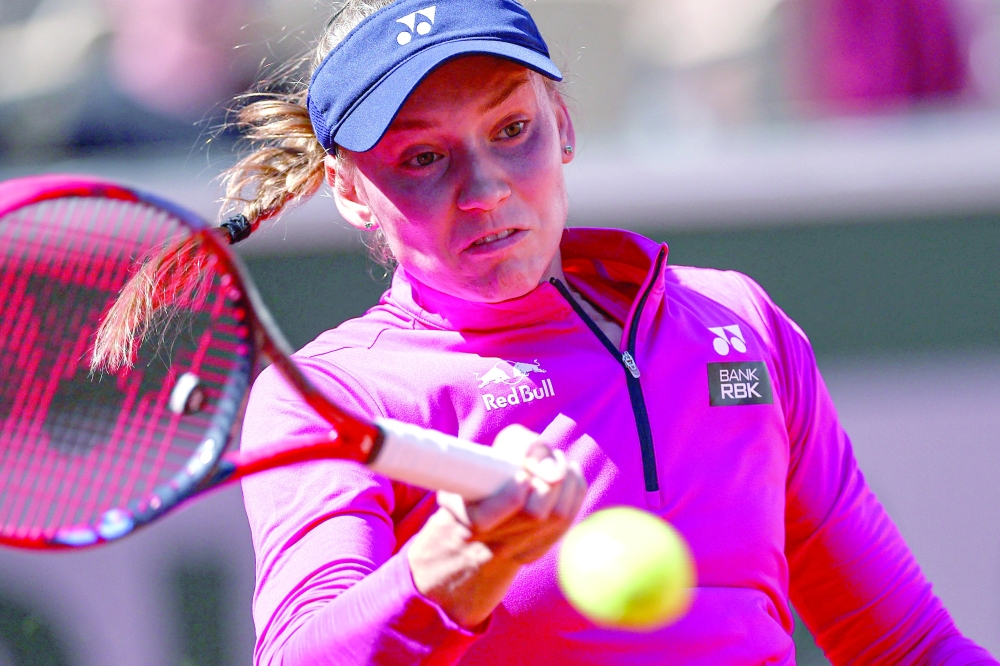 Kazakhstan's Elena Rybakina plays a forehand return to Czech Republic's Linda Noskova during their women's singles match on day five of the Roland-Garros Open tennis tournament at the Court Suzanne-Lenglen in Paris on June 1, 2023. (Photo by Anne-Christine POUJOULAT / AFP)