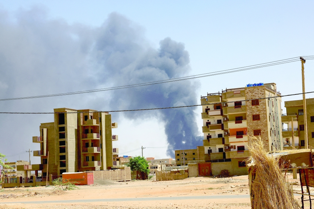 Smoke rises above buildings after an aerial bombardment, during clashes between the paramilitary Rapid Support Forces and the army in Khartoum North, Sudan. - REUTERS