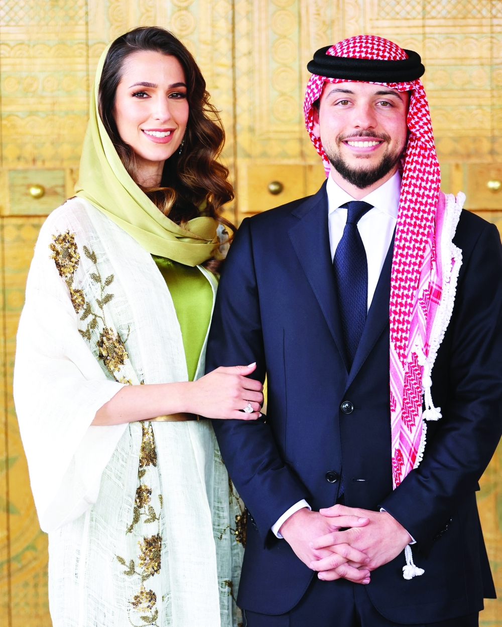 Jordan's Crown Prince Hussein stands with Rajwa Al Saif, the youngest daughter of Saudi businessman Khaled Al Saif, during their engagement in Riyadh, Saudi Arabia, in this handout picture released by the Royal Hashemite Court. The nuptials of Crown Prince Hussein, 28, and architect Rajwa Al Saif, 29, took place on Thursday at the Zahran Palace, the same venue chosen by the crown prince's father, King Abdullah II, and his grandfather, the late king Hussein. - Reuters