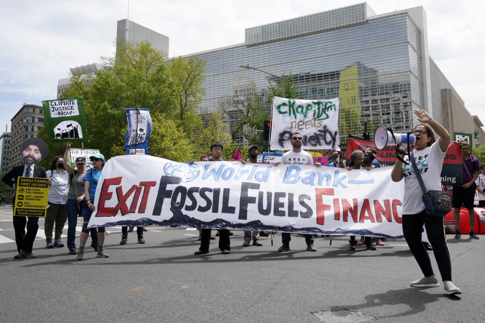Activists protest during meetings of the International Monetary Fund and World Bank in Washington. — The New York Times