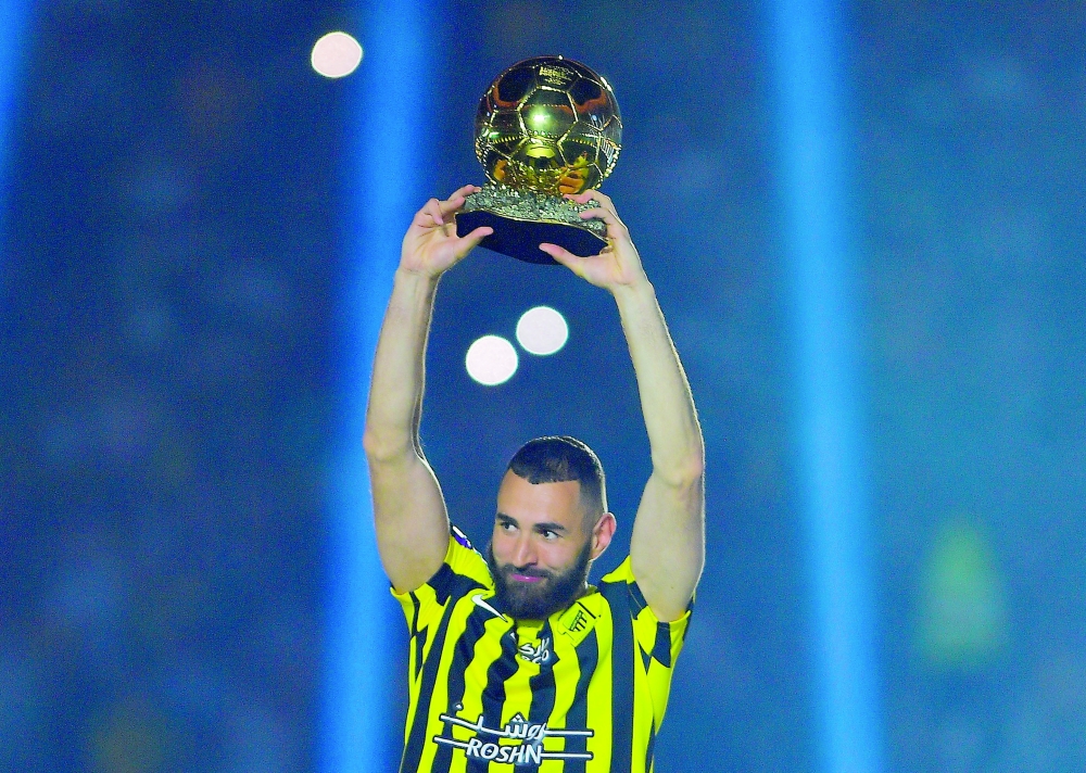 Soccer Football - Welcome ceremony for Karim Benzema after joining Al-Ittihad - Jeddah, Saudi Arabia - June 8, 2023 Al-Ittihad's Karim Benzema shows his Golden Ball during his presentation. REUTERS/Stringer
