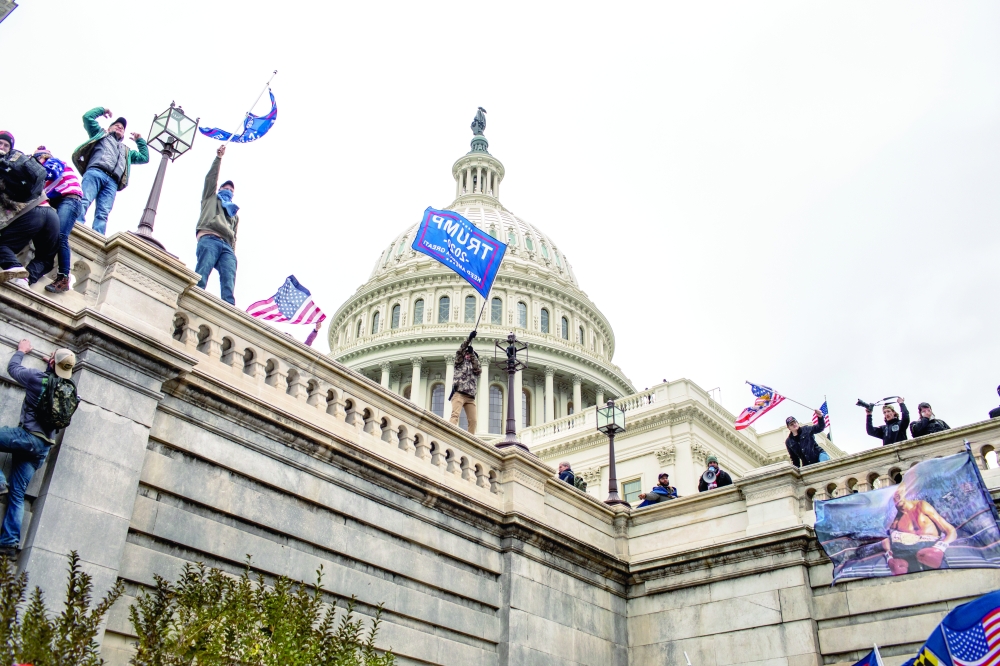 Supporters of President Donald Trump storm the Capitol in Washington on January 6, 2021. 
