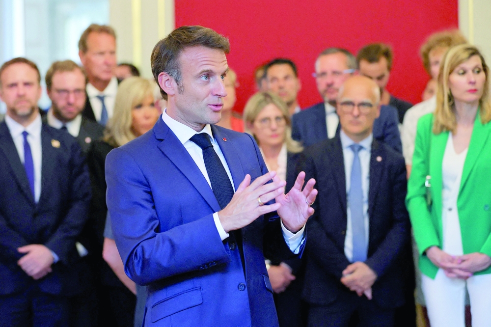 French President Emmanuel Macron at a meeting with rescue forces at the Haute-Savoie prefecture, a day after a mass stabbing in a park, in Annecy, in the French Alps. - AFP