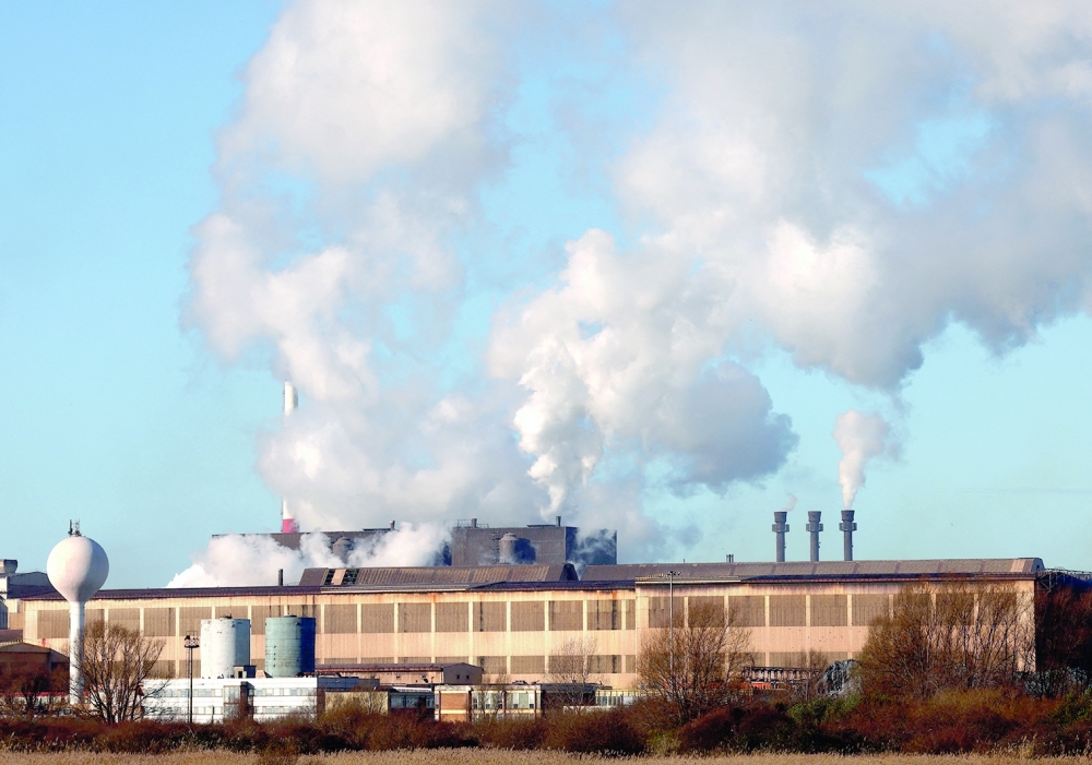 Smoke rises from chimneys at a factory in the port of Dunkirk. — Reuters file photo