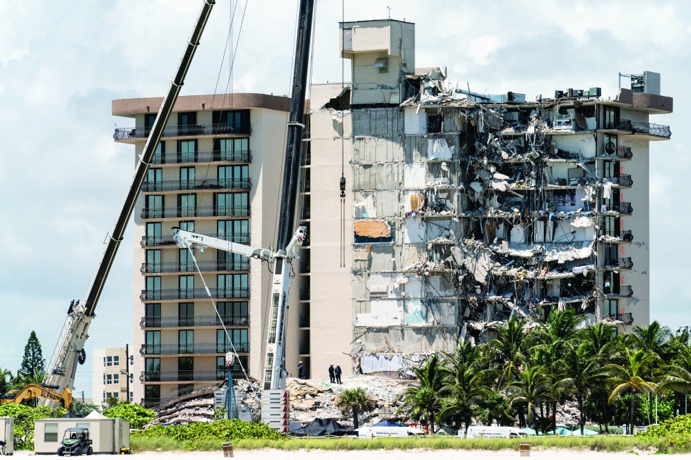 First responders continue their search for victims of the partially-collapsed Champlain Towers South building in Surfside, Fla. on June 27, 2021. (Erin Schaff/The New York Times)