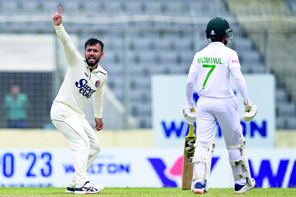 Afghanistan's Zahir Khan (L) appeals for leg before wicket (LBW) against Bangladesh's Najmul Hossain Shanto (not pictured) during the third day of the Test cricket match between Bangladesh and Afghanistan at the Sher-e-Bangla National Cricket Stadium in Dhaka on June 16, 2023.  (Photo by Munir uz ZAMAN / AFP)

