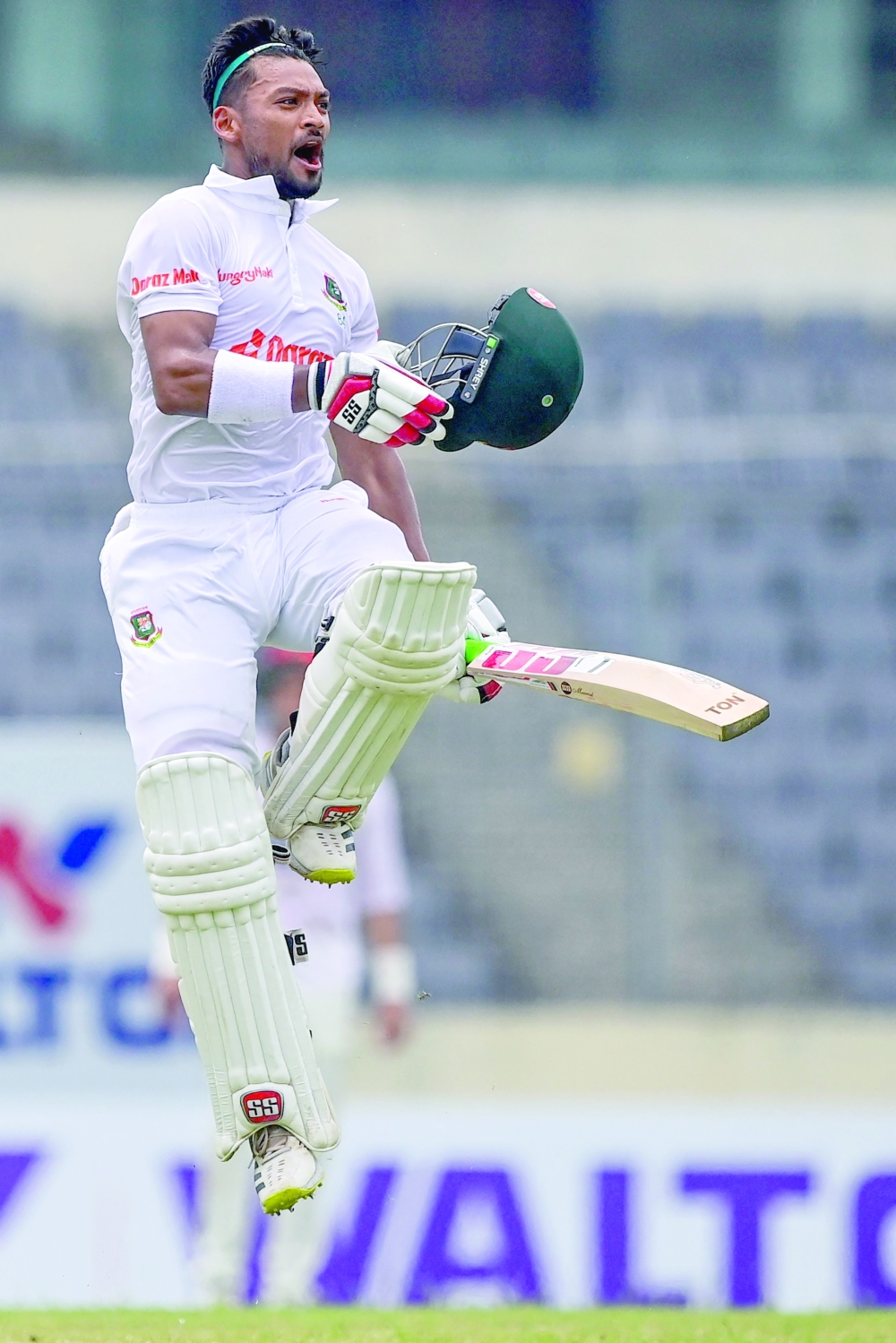 Bangladesh's Najmul Hossain Shanto celebrates after scoring a century (100 runs) during the third day of the Test cricket match between Bangladesh and Afghanistan at the Sher-e-Bangla National Cricket Stadium in Dhaka on June 16, 2023.  (Photo by Munir uz ZAMAN / AFP)

