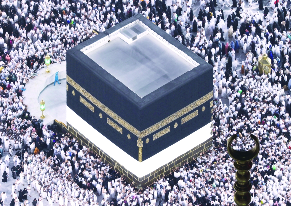 Muslim pilgrims perform the Umrah at the Holy Kaaba, as they start arriving to perform the annual haj at the Grand Mosque. — Reuters 
