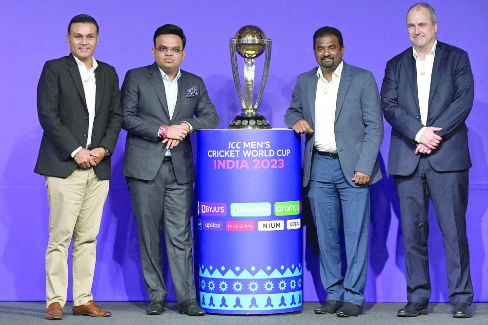 Former Indian cricketer Virender Sehwag (L), BCCI Secretary Jay Shah (2L), former Sri Lankan cricketer Muttiah Muralitharan (2R) and ICC Chief Executive Geoff Allardice pose with the trophy of the upcoming Men痴 Cricket World Cup during an event announcing the tournament's schedule, in Mumbai on June 27, 2023. India will host Pakistan's cricket team for the first time in seven years for the 50-over World Cup, the International Cricket Council said on June 27. The tournament will begin on October 5 with holders England taking on New Zealand at the world's biggest cricket stadium in Ahmedabad, which will also host the final. (Photo by Indranil MUKHERJEE / AFP)

