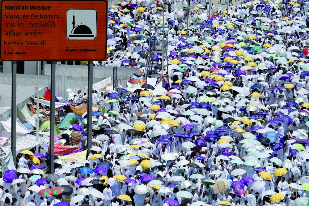 Mulism pilgrims gather around the Namirah mosque near the Mount Arafat. — AFP 