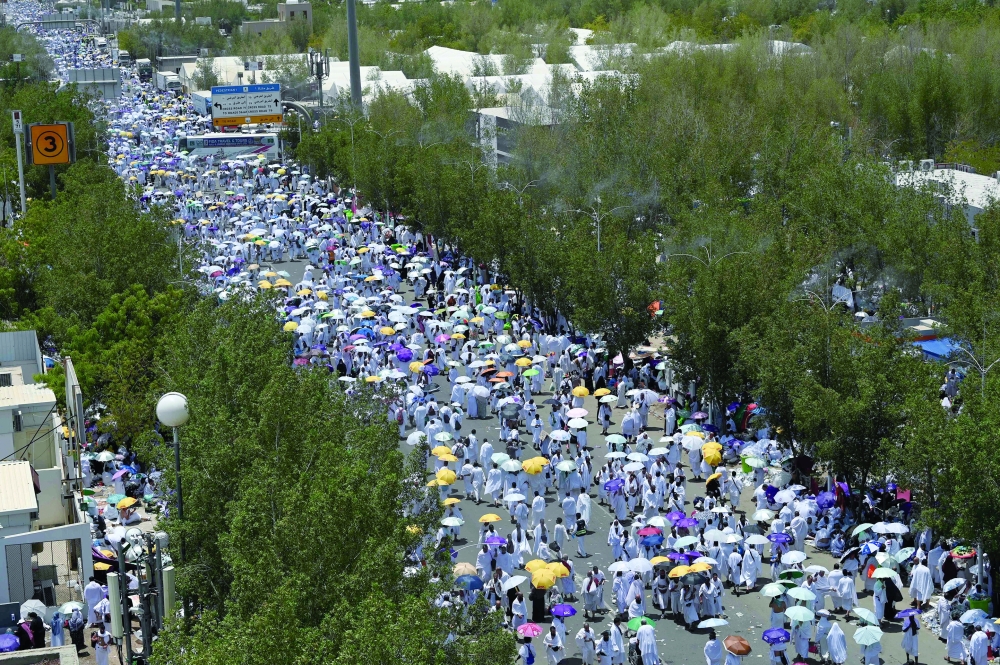 Mulism pilgrims walk towards Mount Arafat, also known as Jabal al-Rahma or Mount of Mercy. — AFP 
