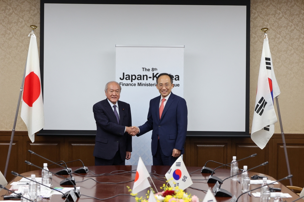 Japan's Finance Minister Shunichi Suzuki meets with his South Korean counterpart Choo Kyungho at a meeting in Tokyo. - Reuters
