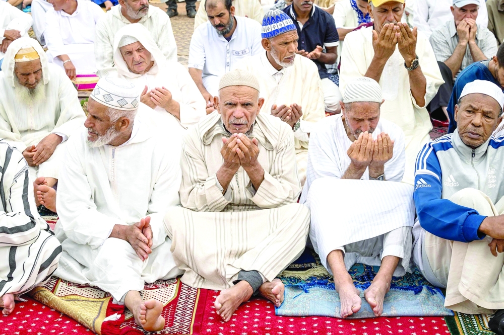 Moroccan worshipers perform Eid morning prayers in Sale. - AFP