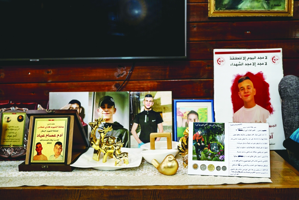 A will belonging to Adam Ayyad, who was shot and killed during an army raid, is framed on a shelf at his mother’s home in the Dheisheh Camp near Bethlehem in the West Bank. 
