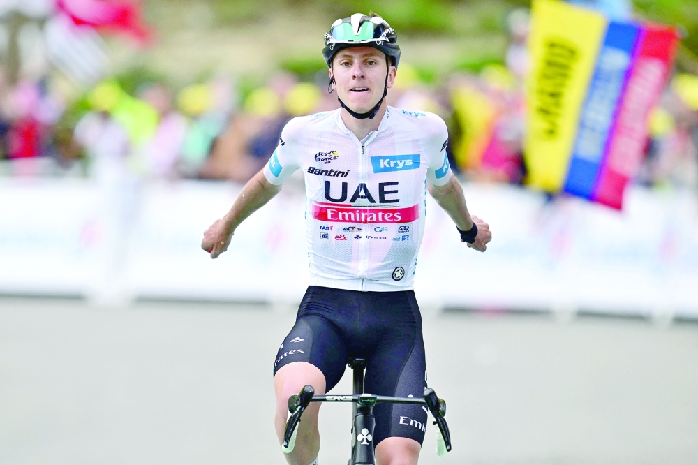 UAE Team Emirates' Slovenian rider Tadej Pogacar cycles to the finish line to win the 6th stage of the 110th edition of the Tour de France cycling race, 145 km between Tarbes and Cauterets-Cambasque, in the Pyrenees mountains in southwestern France, on July 6, 2023. (Photo by Marco BERTORELLO / AFP)

