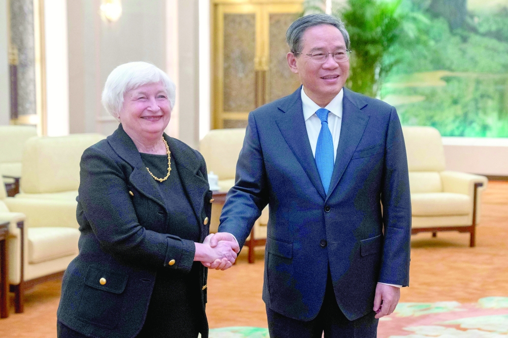 Chinese Premier Li Qiang with US Treasury Secretary Janet Yellen during a meeting at the Great Hall of the People in Beijing. - AFP
