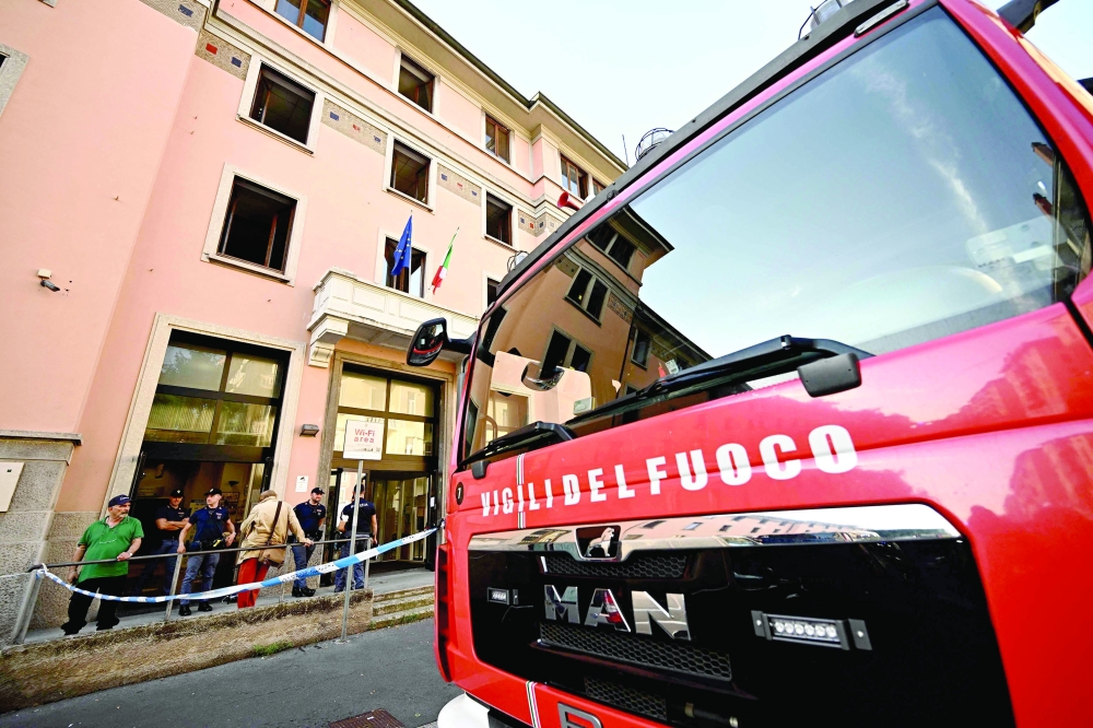 A firefighter vehicle is parked outside a retirement home after a fire killed six residents in Milan. - AFP