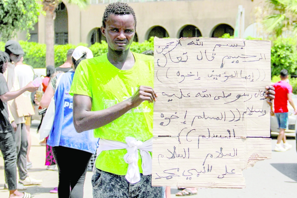 A sub-Saharan migrant during a protest against the dire conditions of migrants in Tunisia's coastal central city of Sfax. - AFP


