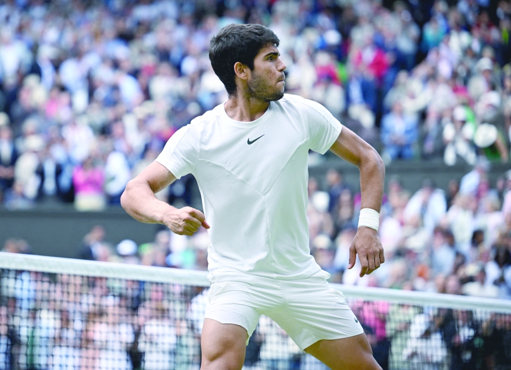 zcTennis - Wimbledon - All England Lawn Tennis and Croquet Club, London, Britain - July 12, 2023 Spain's Carlos Alcaraz celebrates after winning his quarter final match against Denmark's Holger Rune REUTERS/Dylan Martinez
