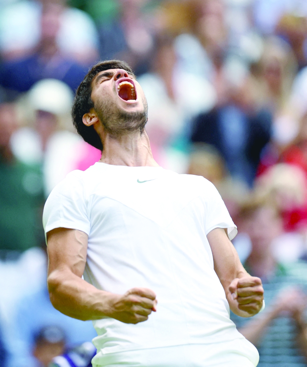 Tennis - Wimbledon - All England Lawn Tennis and Croquet Club, London, Britain - July 12, 2023 Spain's Carlos Alcaraz celebrates winning his quarter final match against Denmark's Holger Rune REUTERS/Hannah Mckay     TPX IMAGES OF THE DAY
