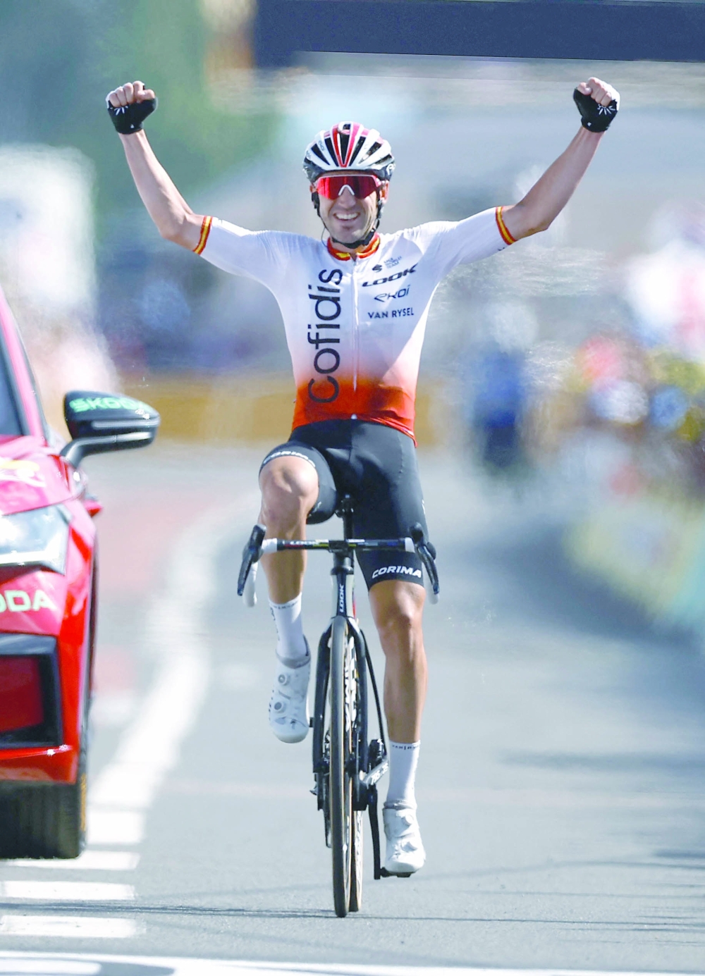 Cycling - Tour de France - Stage 12 - Roanne to Belleville-En-Beaujolais - France - July 13, 2023 Cofidis' Ion Izagirre Insausti celebrates as he crosses the finish line to win stage 12 REUTERS/Stephane Mahe
