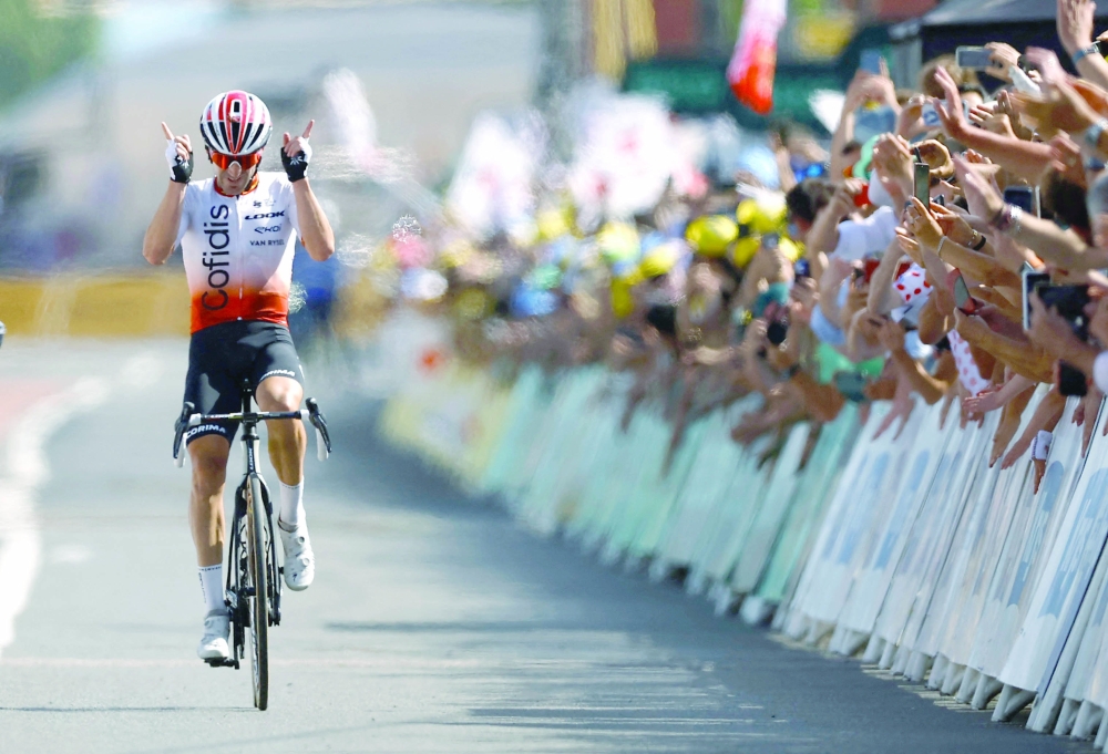 Cycling - Tour de France - Stage 12 - Roanne to Belleville-En-Beaujolais - France - July 13, 2023 Cofidis' Ion Izagirre Insausti celebrates as he crosses the finish line to win stage 12 REUTERS/Stephane Mahe
