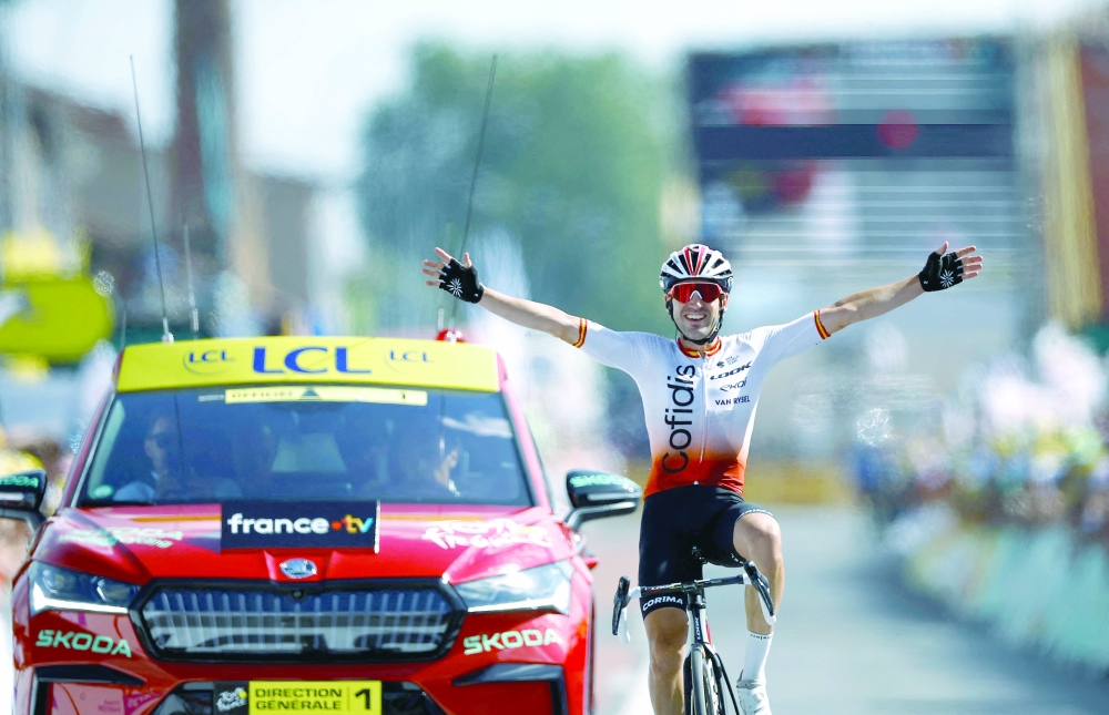 Cycling - Tour de France - Stage 12 - Roanne to Belleville-En-Beaujolais - France - July 13, 2023 Cofidis' Ion Izagirre Insausti celebrates as he crosses the finish line to win stage 12 REUTERS/Stephane Mahe
