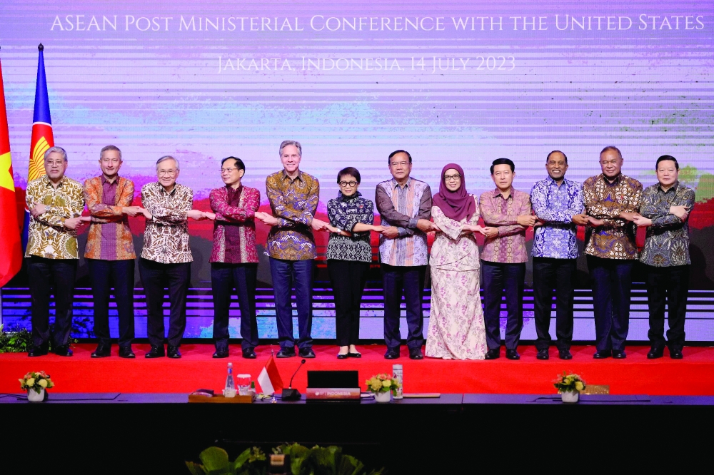 Asean ministers pose for a group photo during the Post Ministerial Conference with the United States at the Asean Foreign Ministers’ Meeting in Jakarta. - AFP