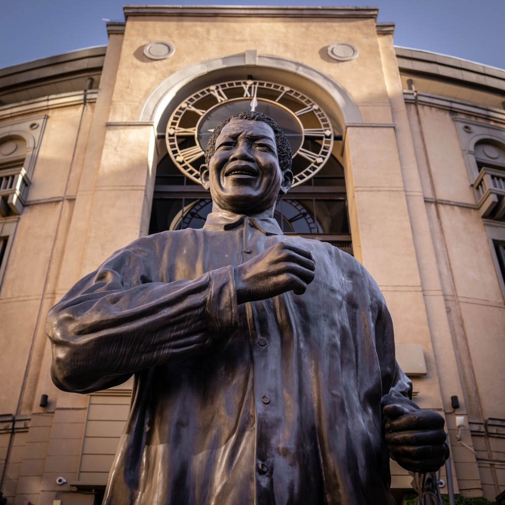A statue at Nelson Mandela Square, a shopping center in the Sandton district of Johannesburg, on July 13, 2023.  (Gulshan Khan/The New York Times)
