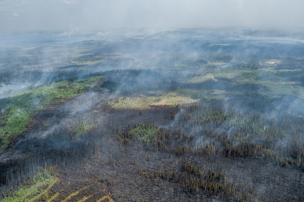Wildfires burning in Quebec, Canada, on June 14, 2023. (Renaud Philippe/The New York Times)