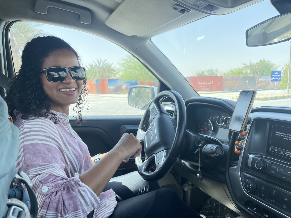 Fatimah Al Zimam, a tour guide in Saudi Arabia, behind the wheel of her pickup truck in Riyadh. (Paige McClanahan via The New York Times)