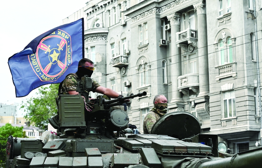 Fighters of Wagner private mercenary group are seen atop of a tank, Southern Military District in the city of Rostov-on-Don. — Reuters file photo