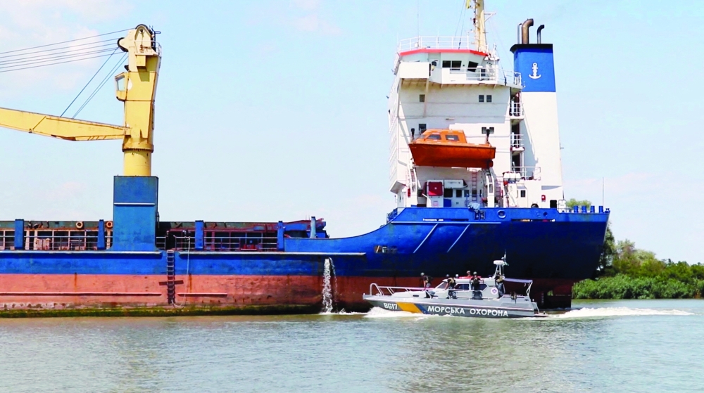 A cargo ship sails followed by a Ukrainian Coast Guard cutter through the Bystre rivermouth, which connects the Black Sea and Danube, in Odesa region, Ukraine. — Reuters file photo