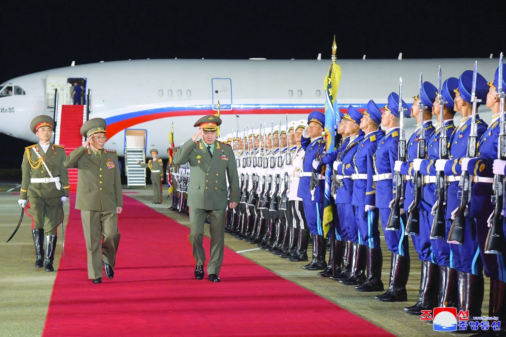 Russian Defence Minister Sergei Shoigu, who is leading a visiting delegation, is welcomed at an airport in Pyongyang, North Korea. — Reuters