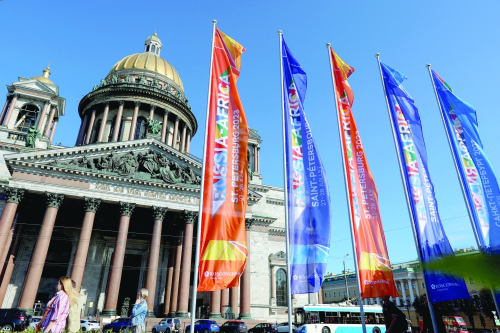 Flags informing of the upcoming Russia-Africa summit fly in front of Saint Isaac's Cathedral in central Saint Petersburg, Russia. — Reuters