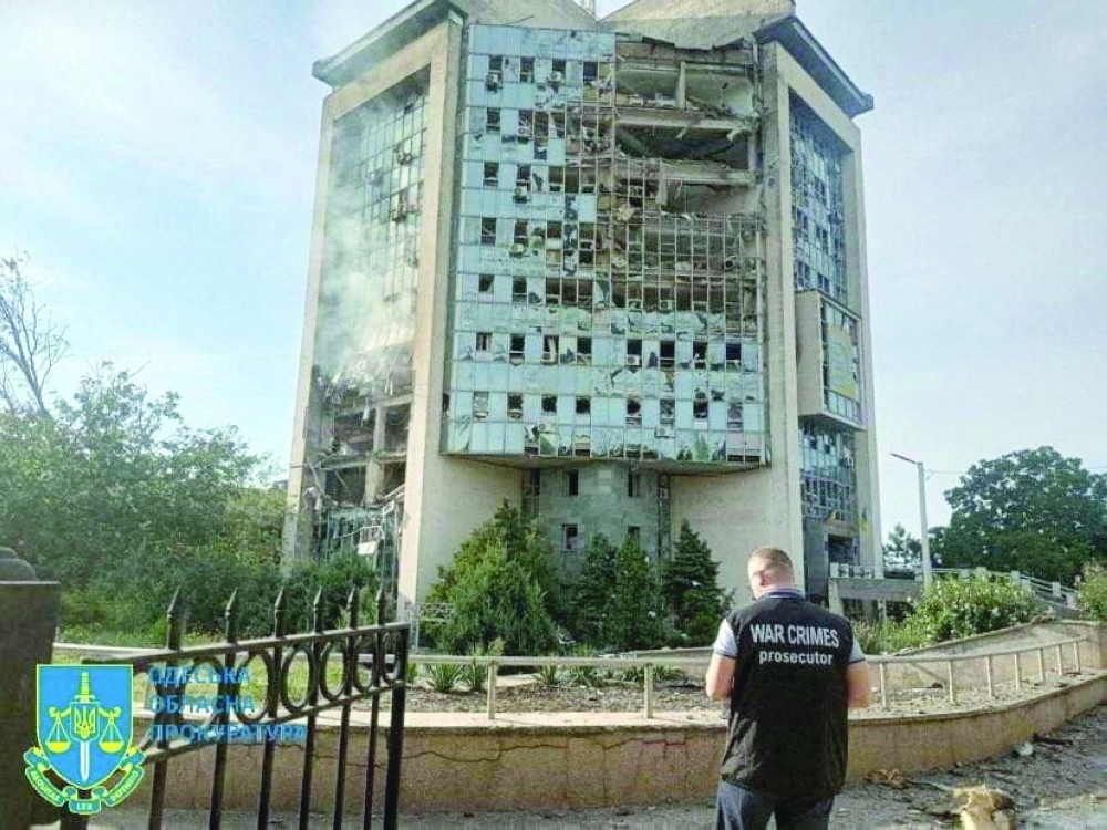 An inspector surveys the damage at a grain port facility after a reported attack by Russian military drones in Izmail, Odesa region, Ukraine, on Wednesday. — Reuters