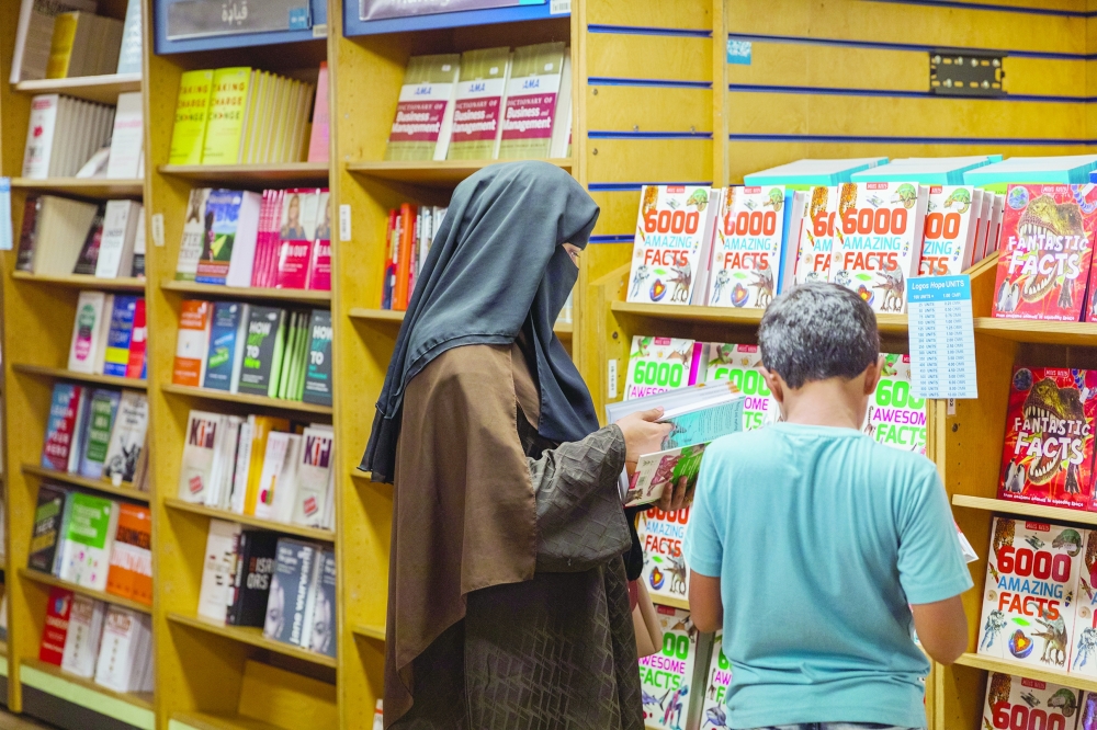 Visitors browsing books at the floating library