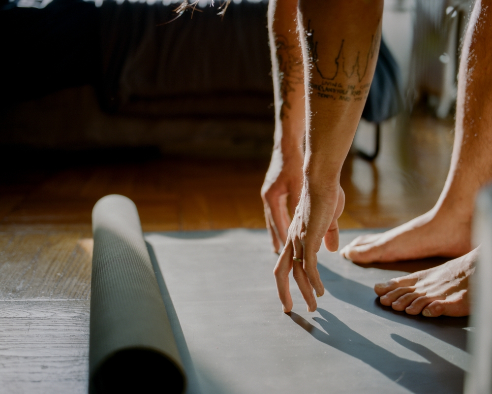 Artist Justin J Wee stretches in his apartment in Brooklyn, on Jan. 14, 2022. (Sasha Arutyunova/The New York Times)