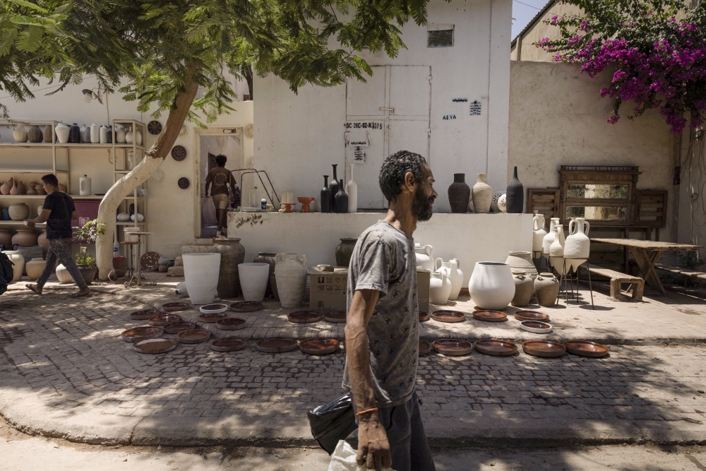 A pottery workshop inside the Darb1718 community in the Fustat area of Cairo, on Aug. 12, 2023. (Sima Diab/The New York Times)